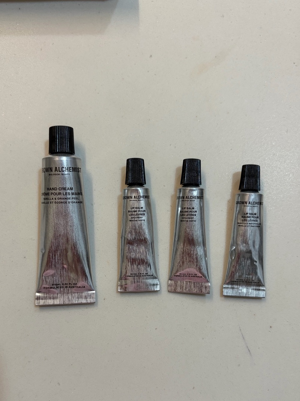 NEW Set of (4) Sealed Grown Alchemist Hand Lotion and Lip Balm travel size set